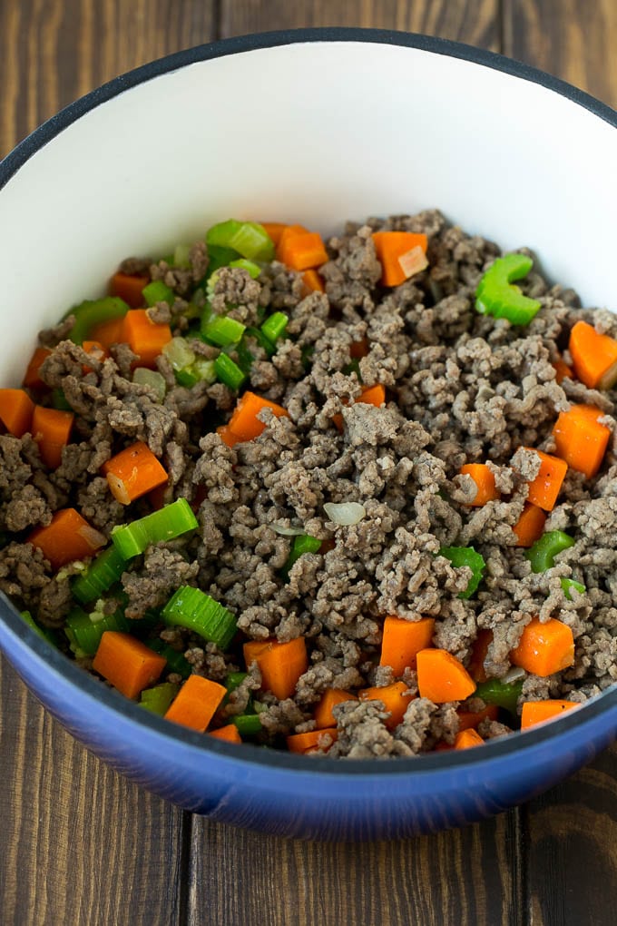 Alphabet Soup Recipe | Hamburger Soup | Beef and Vegetable Soup #soup #hamburger #noodles #dinner #ezlod #carrots Ground beef, carrots, onion and celery in a soup pot.
