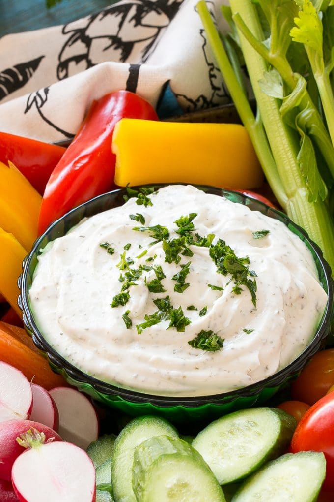 Homemade Ranch Dip Recipe | Homemade Ranch Powder | Homemade Ranch Dressing | Best Ranch Dip #ranch #dip #appetizer #snack #ezlod A bowl of dip topped with chopped parsley and surrounded by vegetables.