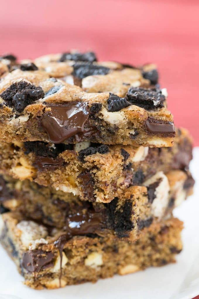 Cookies and Cream Bars Recipe | Oreo Bars | Blondie Recipe #chocolate #oreo #blondies #baking #cookies #ezlod A stack of blondies filled with chocolate chunks and chopped cookies.