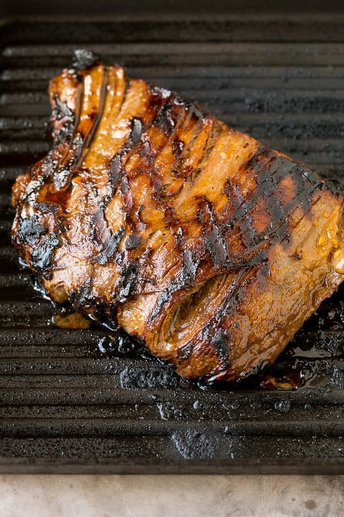 Flank Steak Marinade Recipe | Marinated Flank Steak | Marinated Steak | Steak Marinade #steak #beef #grilling #marinade #dinner #ezlod Beef cooked on a grill pan.
