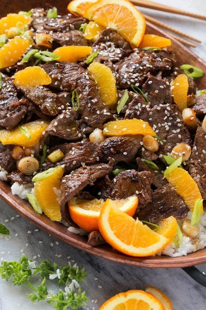 Orange Beef Stir Fry Recipe | 4 Ingredient Orange Beef | Easy Orange Beef #orange #beef #stirfry #asian #dinner #ezlod Orange beef topped with green onions and sesame seeds.