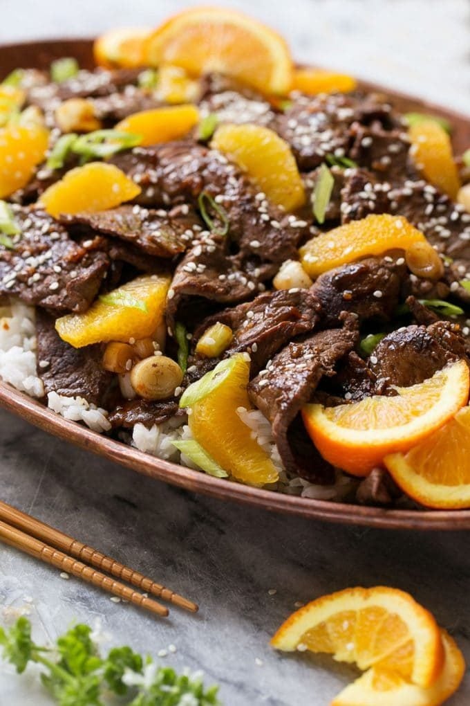 Orange Beef Stir Fry Recipe | 4 Ingredient Orange Beef | Easy Orange Beef #orange #beef #stirfry #asian #dinner #ezlod A platter of beef in orange sauce.