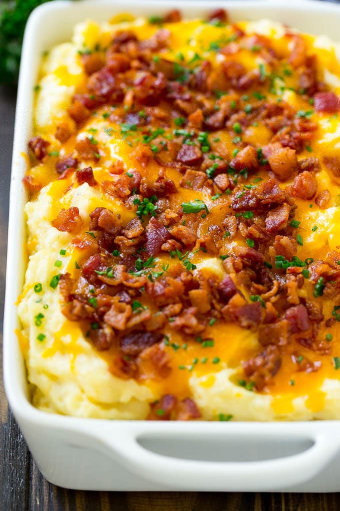 Loaded Mashed Potato Casserole Recipe | Loaded Potatoes | Bacon Mashed Potatoes | Thanksgiving Mashed Potatoes #potatoes #bacon #cheese #casserole #Thanksgiving #dinner #ezlod A casserole of loaded mashed potatoes topped with cheddar cheese, crispy bacon and chives.