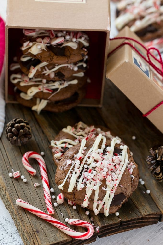Peppermint Bark Cookie | Easy Peppermint Bark Cookies | Christmas Cookies | Peppermint Bark Cookies | Chocolate Peppermint Cookie #peppermint #peppermintbark #cookies #christmas #holiday #dessert #ezlod Chocolate Peppermint Cookies topped with crushed candy canes in a gift box.