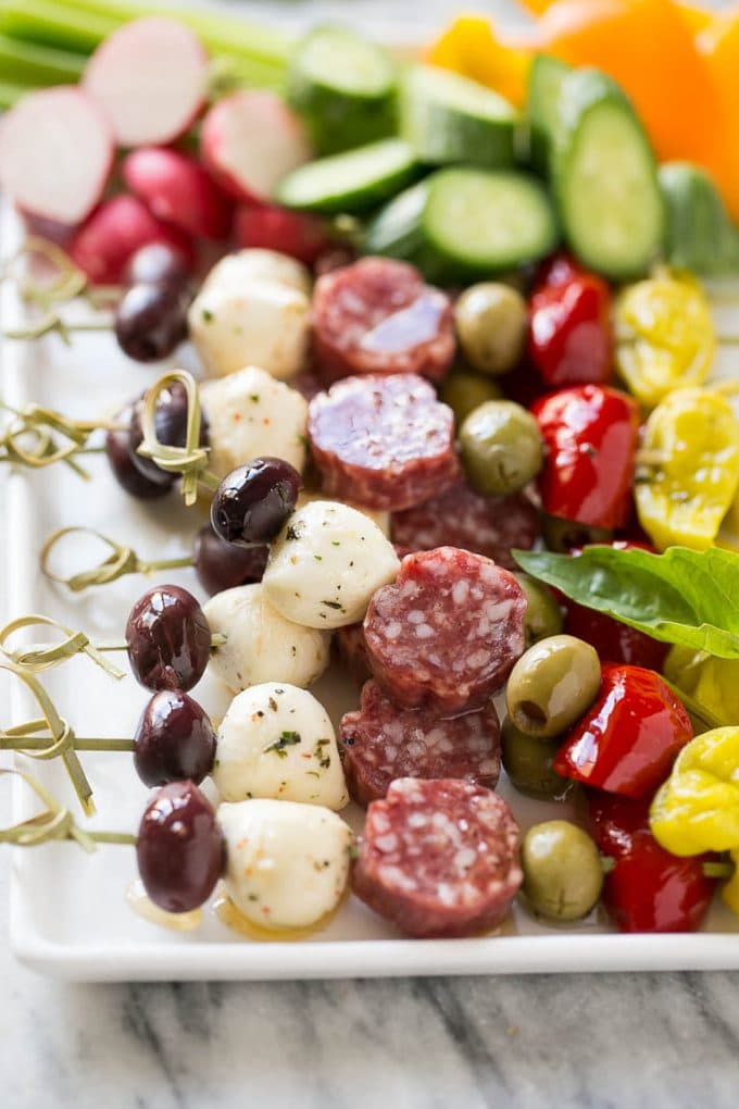 Antipasto Skewers Recipe | Easy Antipasto | Best Antipasto #antipasto #skewers #appetizer #ezlod Antipasto skewers on a white serving platter.
