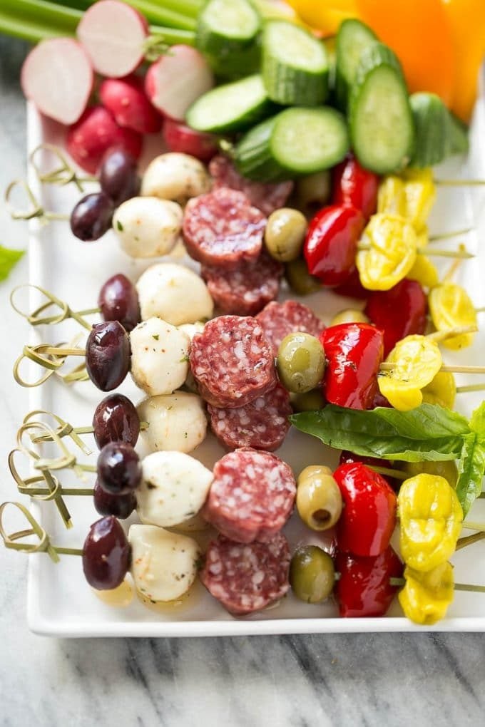 Antipasto Skewers Recipe | Easy Antipasto | Best Antipasto #antipasto #skewers #appetizer #ezlod A tray of antipasto kabobs with meat, olives and vegetables.