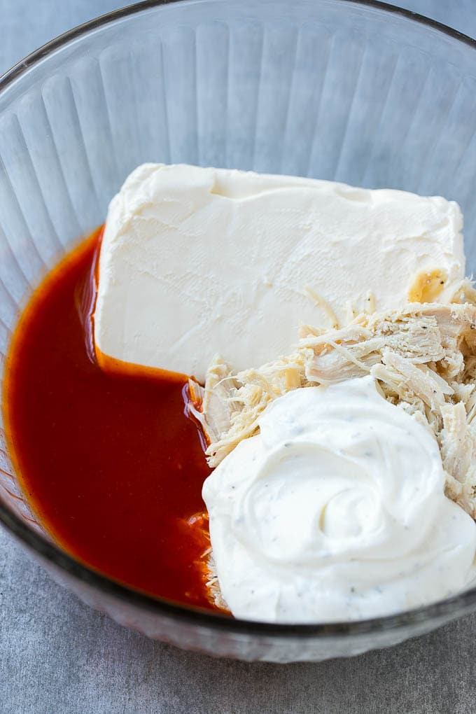Buffalo Ranch Chicken Dip | Buffalo Chicken Dip | Baked Buffalo Dip | Cheesy Buffalo Dip #buffalowings #buffalochicken #dip #lowcarb #appetizer #ezlod Ingredients for the dip in a bowl.