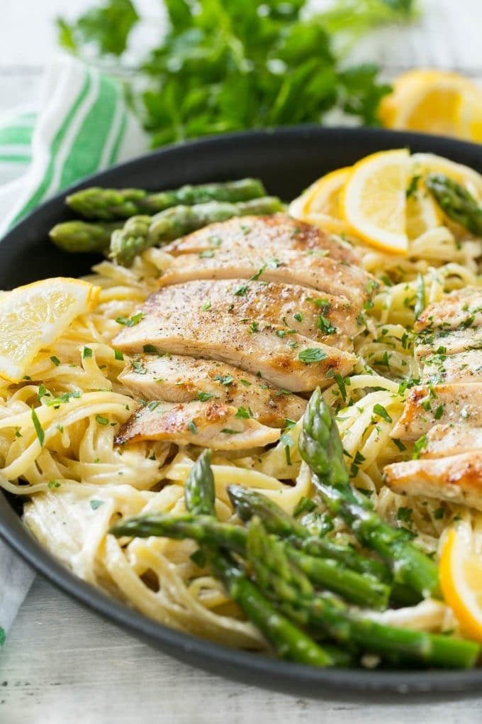 Lemon Asparagus Pasta with Grilled Chicken Recipe | Asparagus Pasta | Grilled Chicken Pasta | Easy Pasta Recipe #pasta #asparagus #lemon #chicken #dinner #ezlod A skillet with lemon asparagus pasta, cream sauce and sliced grilled chicken.
