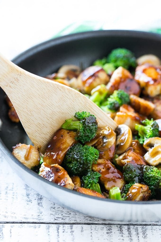 Chicken and Broccoli Stir Fry Recipe | Chicken Stir Fry | Healthy Chicken Recipe | Chicken and Broccoli | Chinese Food #chicken #broccoli #stirfry #healthy #cleaneating #dinner #ezlod A spatula scooping chicken stir fry out of a pan.