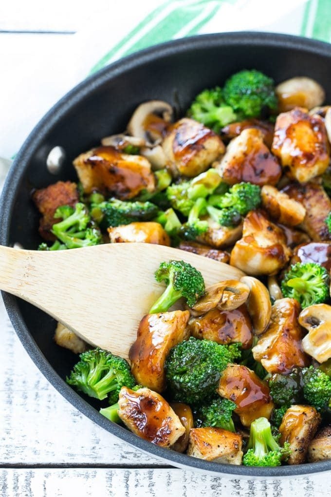 Chicken and Broccoli Stir Fry Recipe | Chicken Stir Fry | Healthy Chicken Recipe | Chicken and Broccoli | Chinese Food #chicken #broccoli #stirfry #healthy #cleaneating #dinner #ezlod A stir fry of chicken, broccoli and mushrooms in a skillet with a spatula.