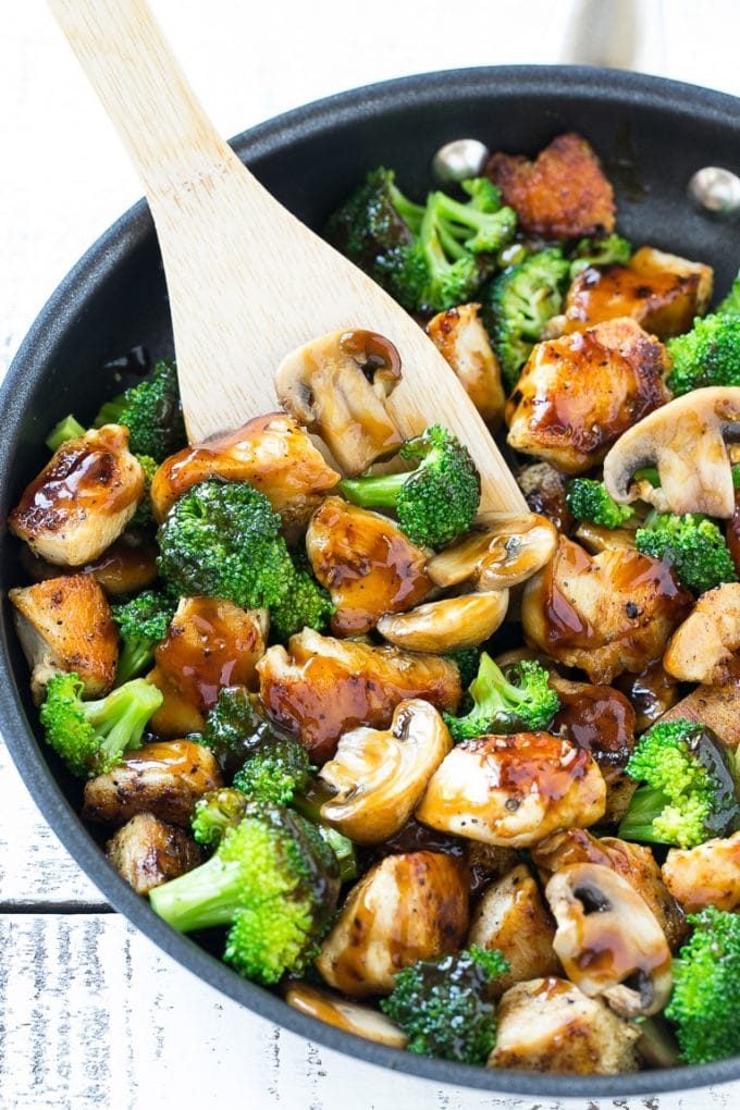 Chicken and Broccoli Stir Fry Recipe | Chicken Stir Fry | Healthy Chicken Recipe | Chicken and Broccoli | Chinese Food #chicken #broccoli #stirfry #healthy #cleaneating #dinner #ezlod Chicken and broccoli stir fry with mushrooms in a skillet with a spatula.
