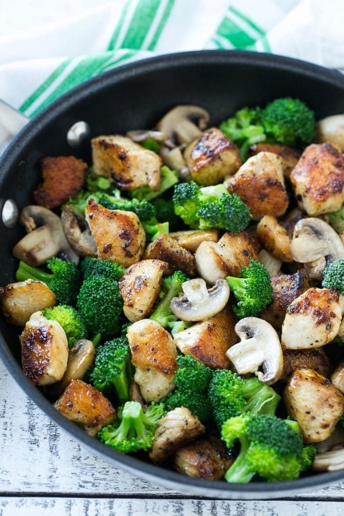 Chicken and Broccoli Stir Fry Recipe | Chicken Stir Fry | Healthy Chicken Recipe | Chicken and Broccoli | Chinese Food #chicken #broccoli #stirfry #healthy #cleaneating #dinner #ezlod Sauteed chicken pieces, broccoli florets and mushrooms in a pan.