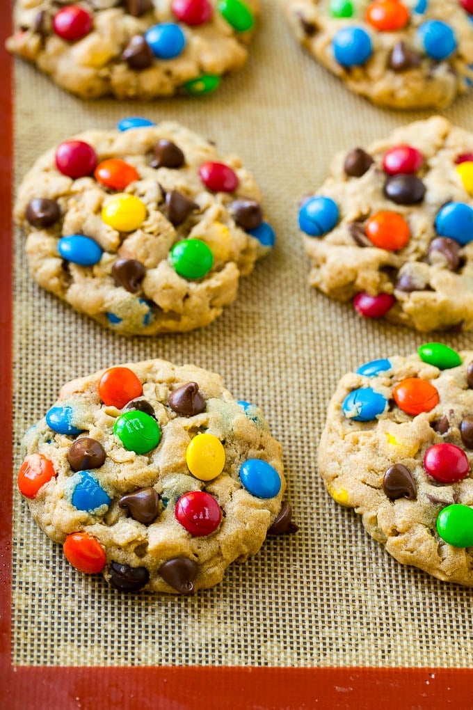 Monster Cookies Recipe | Oatmeal Cookies | Peanut Butter Cookies | M&M's Cookies #baking #cookies #dessert #peanutbutter #chocolate #ezlod Baked monster cookies on a sheet pan.