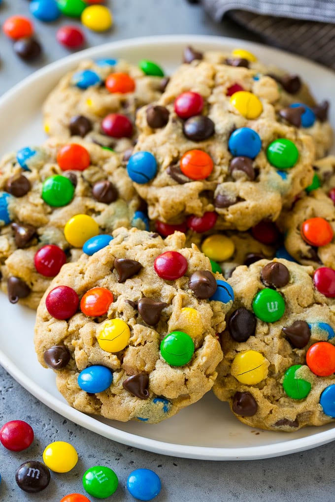 Monster Cookies Recipe | Oatmeal Cookies | Peanut Butter Cookies | M&M's Cookies #baking #cookies #dessert #peanutbutter #chocolate #ezlod A plate of monster cookies which are made with oats, peanut butter, chocolate chips and M&M's.