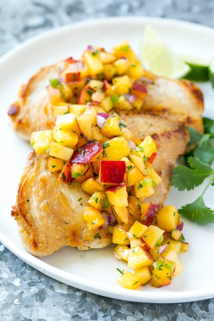 Peach Salsa | Fruit Salsa #peaches #salsa #dip #appetizer #ezlod Peach salsa served over grilled chicken breast.