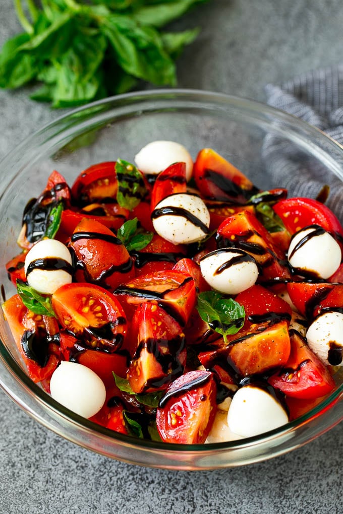 Caprese Salad Recipe | Tomato Salad #salad #tomato #mozzarella #cheese #basil #caprese #summer #ezlod Caprese salad with tomatoes, fresh mozzarella, basil leaves and balsamic glaze.