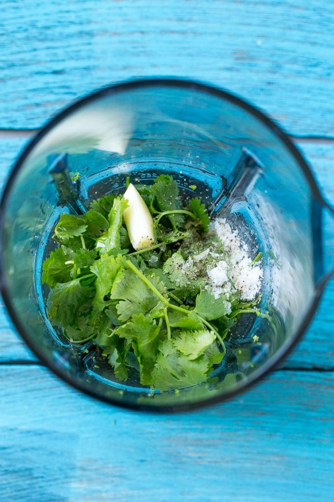 Cilantro Lime Chicken | Grilled Chicken #chicken #grilling #cilantro #lime #dinner #ezlod A blender full of cilantro leaves, garlic, lime juice and olive oil.