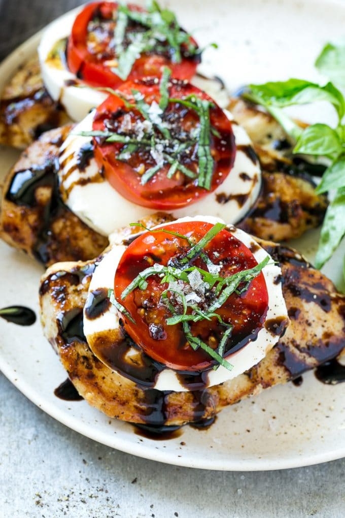 Chicken Caprese Recipe | Grilled Chicken #chicken #caprese #grilling #dinner #tomato #basil #ezlod Chicken caprese with sliced tomatoes, balsamic glaze, fresh mozzarella and shredded basil.