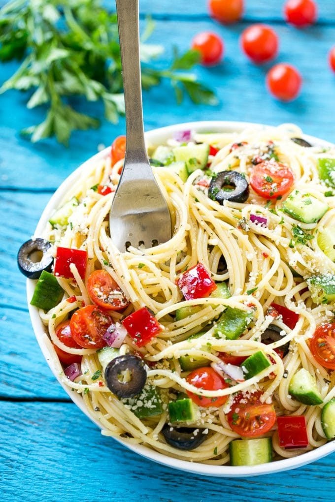 Spaghetti Salad Recipe | Pasta Salad | Potluck Recipe | Easy Pasta Salad #spaghetti #pasta #salad #ezlod A bowl of spaghetti salad with a serving fork in it.
