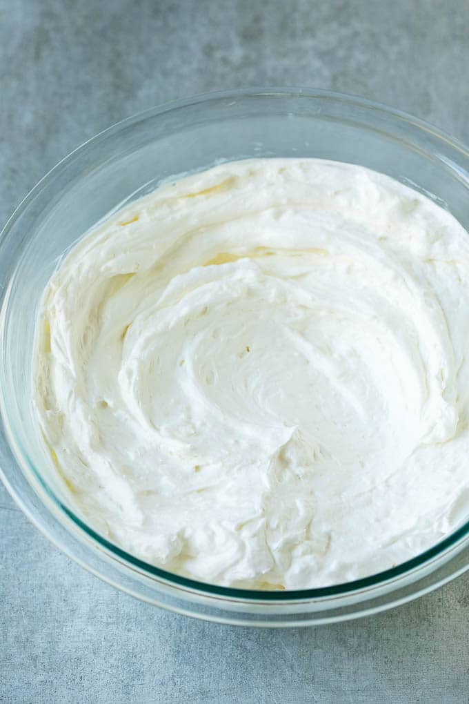 Cream Cheese Fruit Dip | Fruit Recipe | Fruit Dip #fruit #dip #creamcheese #snack #dessert #ezlod Cream cheese, marshmallow cream and whipped topping in a mixing bowl.