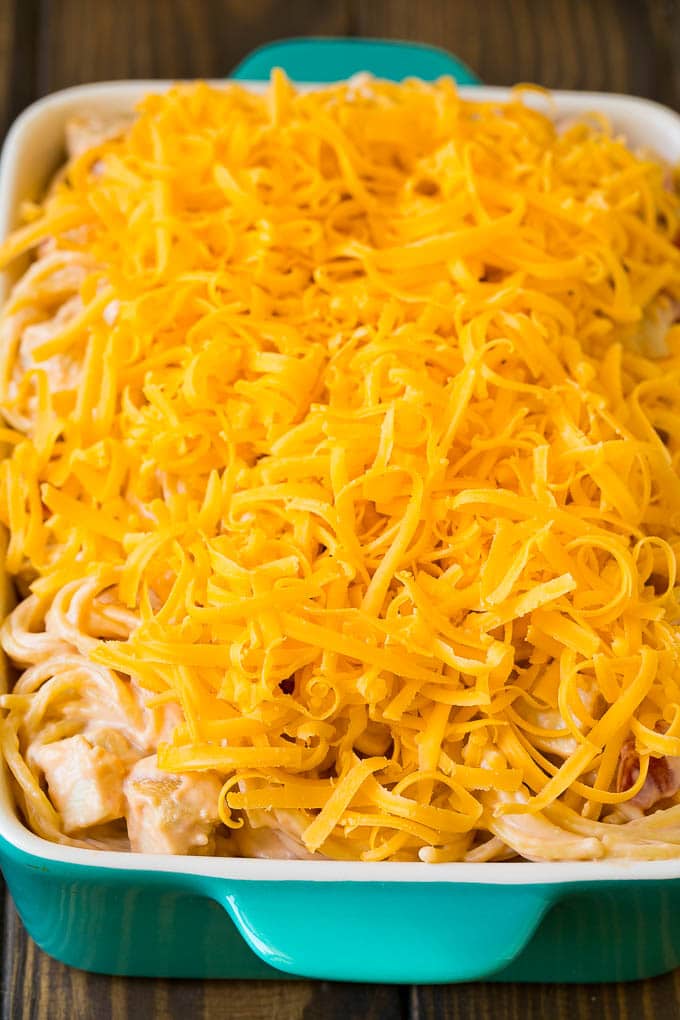 Chicken Spaghetti Recipe | Baked Spaghetti #pasta #spaghetti #chicken #cheese #casserole #dinner #ezlod A baking dish of creamy spaghetti topped with cheese.