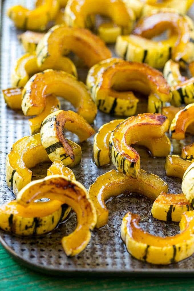 Brown Sugar Delicata Squash Recipe | Roasted Squash | Delicata Squash | Winter Squash Recipe #squash #wintersquash #brownsugar #sidedish #delicatasquash #dinner #ezlod A delicata squash recipe with brown sugar roasted squash on a sheet pan.