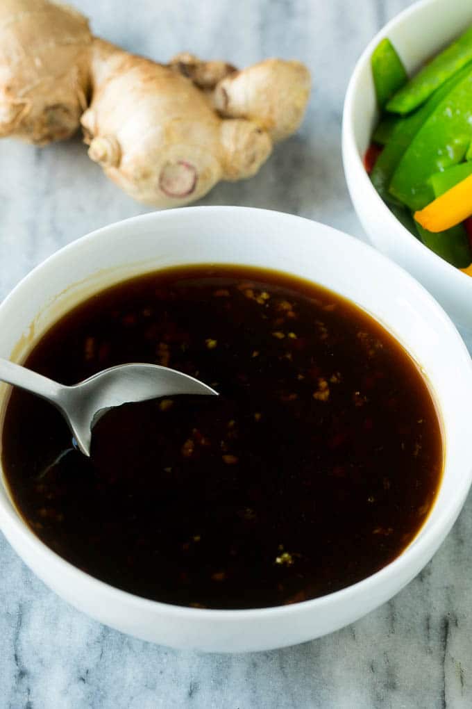 Teriyaki Shrimp Stir Fry Recipe | Shrimp Stir Fry | Healthy Stir Fry #shrimp #teriyaki #vegetables #stirfry #dinner #ezlod A bowl of homemade teriyaki sauce with a spoon in it.