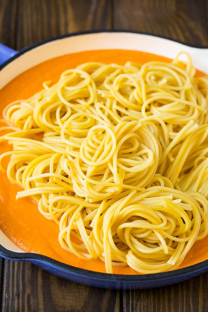 Butternut Squash Pasta Recipe #pasta #squash #bacon #fall #dinner #ezlod Spaghetti in a pool of butternut squash sauce.