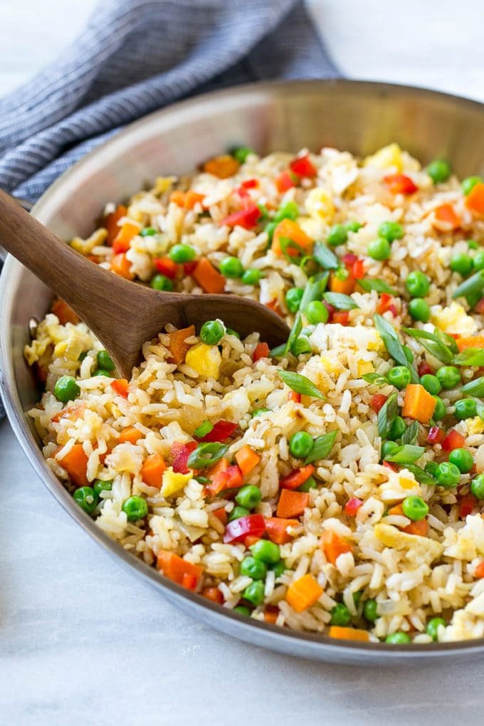 Veggie Fried Rice Recipe | Vegetarian Fried Rice | Easy Fried Rice Recipe | Chinese Food #rice #friedrice #veggie #vegetarian #sidedish #ezlod Veggie fried rice in a skillet with a serving spoon.