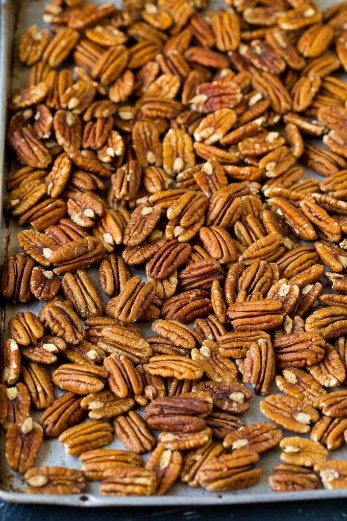 Candied Pecans Recipe | Glazed Pecans | Sugared Pecans #pecans #nuts #snack #dessert #ezlod Pecan halves on a sheet pan.