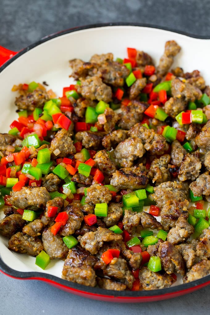 Sweet Potato Hash #sweetpotato #sausage #breakfast #brunch #ezlod Sausage, onions and bell peppers in a skillet.