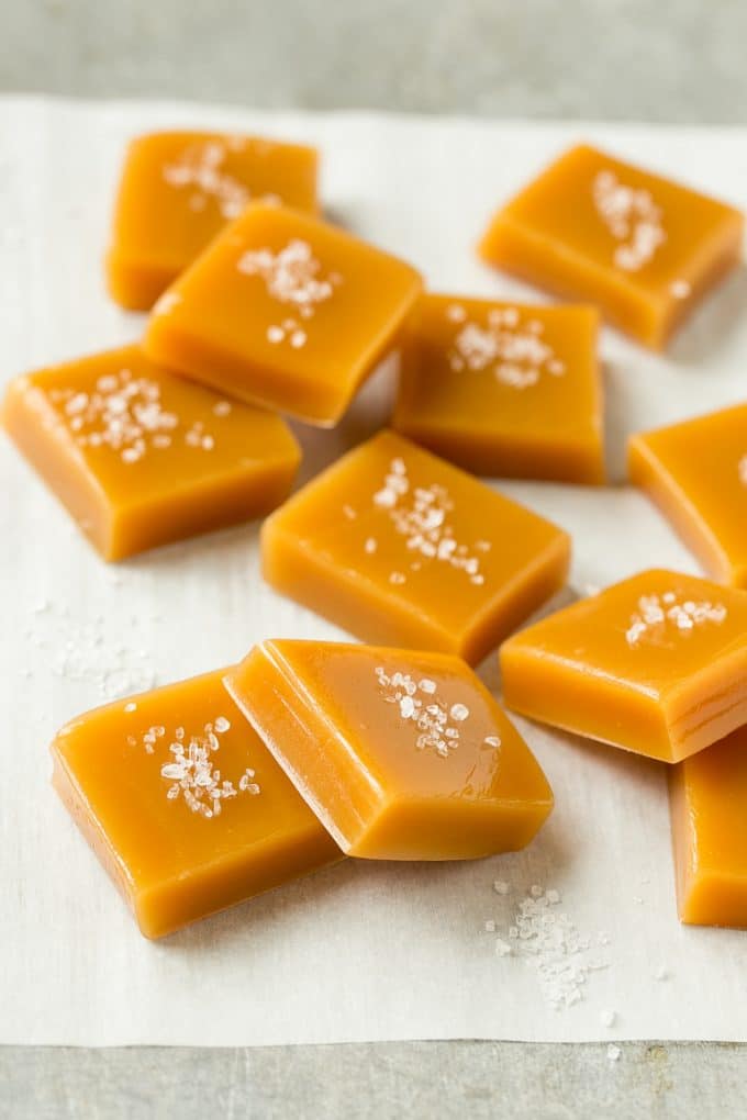Microwave Caramels with Sea Salt Recipe | Homemade Caramels | Sea Salt Caramel | Homemade Candy #candy #caramels #caramel #microwavecaramels #homemade #dessert #ezlod Squares of caramel topped with coarse salt.