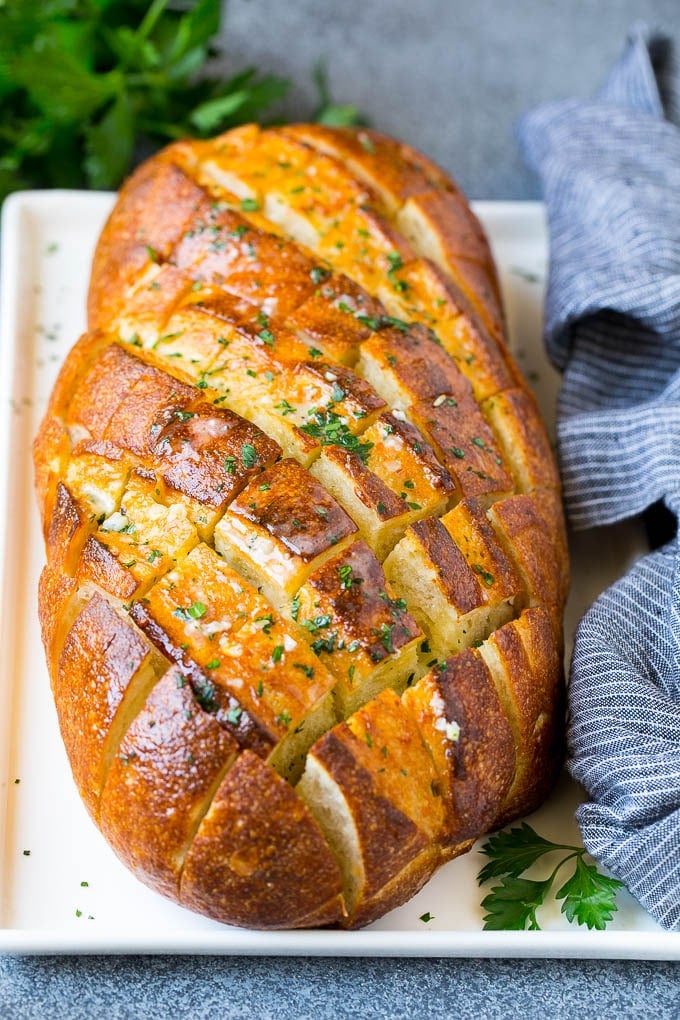 Pull Apart Bread | Garlic Bread | Cheese Bread #bread #garlic #cheese #sidedish #appetizer #ezlod Baked garlic pull apart bread garnished with parsley.