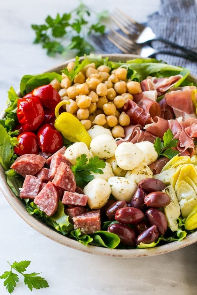 Antipasto Salad Recipe | Italian Salad | Main Course Salad | Antipasto Recipe #salad #salami #italianfood #dinner #lunch #ezlod Antipasto salad with cured meats, fresh mozzarella cheese and roasted peppers over salad greens.
