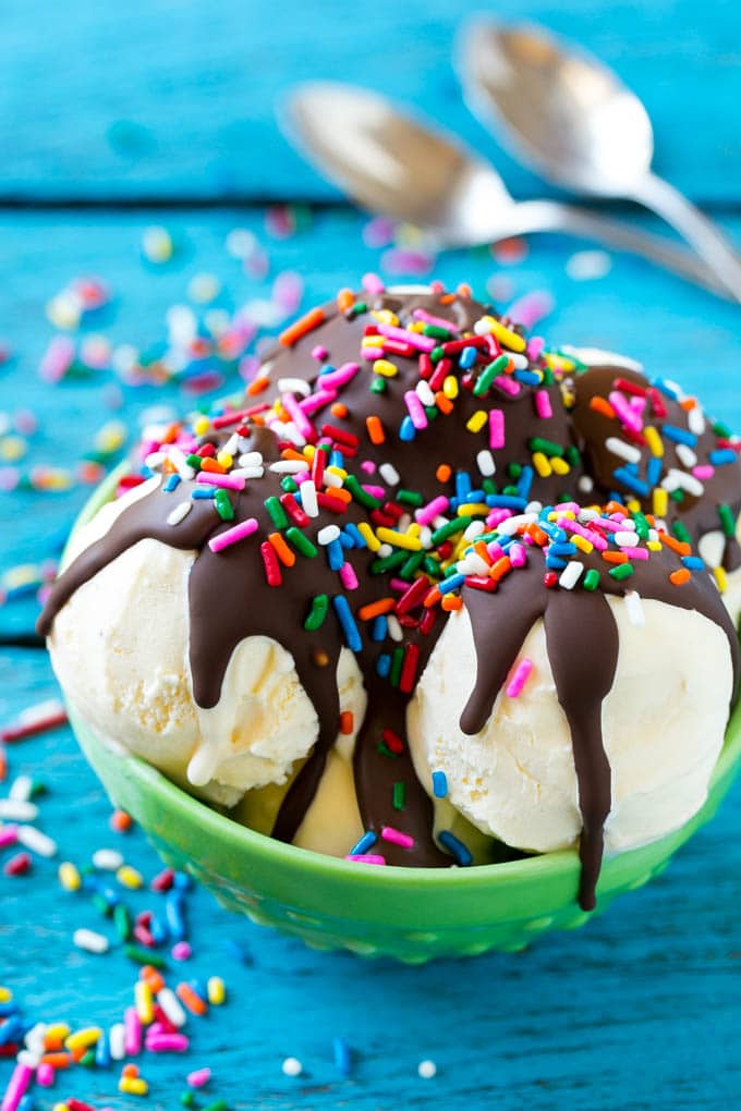 Homemade Magic Shell Recipe | Chocolate Ice Cream Topping | Chocolate Sauce | Hard Chocolate Coating #chocolate #icecream #dessert #ezlod Magic shell over scoops of ice cream, topped with rainbow sprinkles.