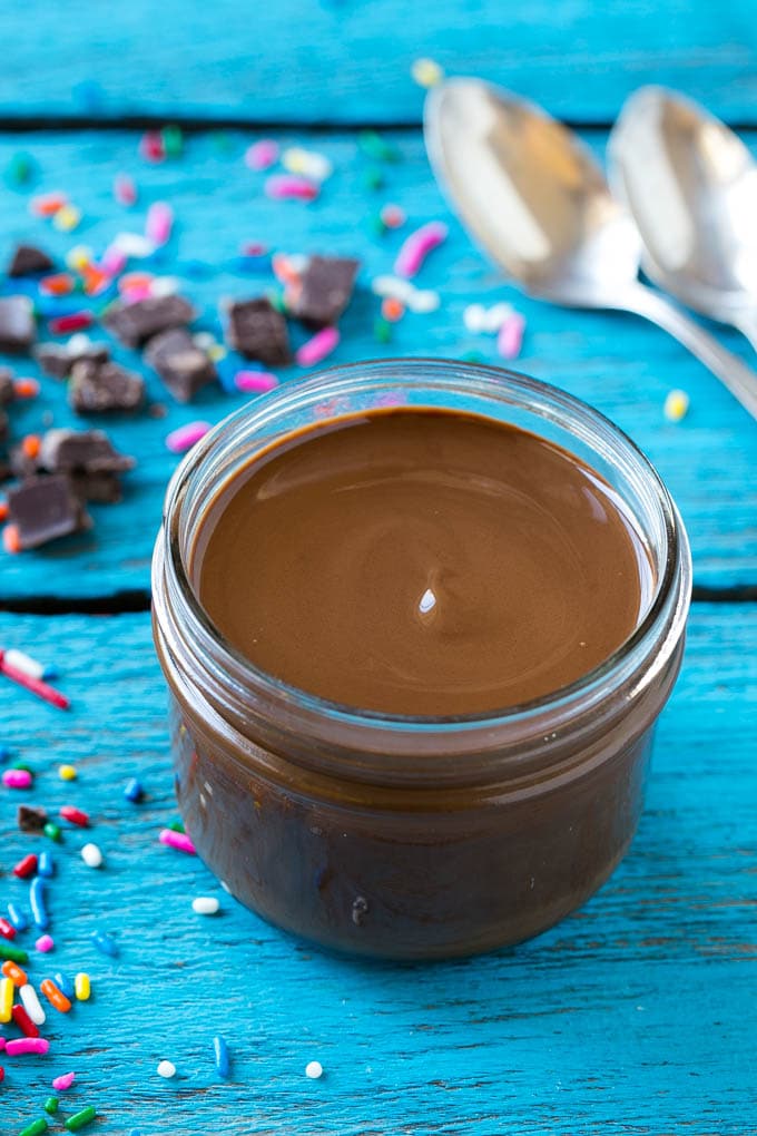 Homemade Magic Shell Recipe | Chocolate Ice Cream Topping | Chocolate Sauce | Hard Chocolate Coating #chocolate #icecream #dessert #ezlod A jar of chocolate chocolate shell.