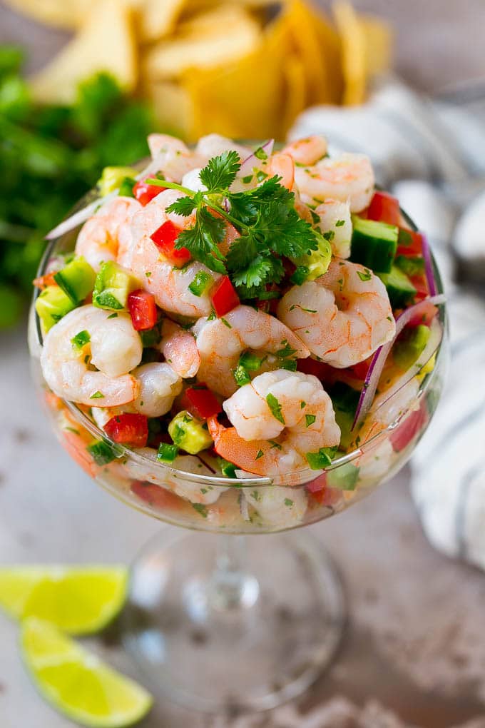 Shrimp Ceviche Recipe | Mexican Shrimp | Marinated Shrimp #shrimp #ceviche #cleaneating #healthy #lowcarb #keto #glutenfree #dinner #appetizer #ezlod Shrimp ceviche in a serving cup garnished with cilantro.