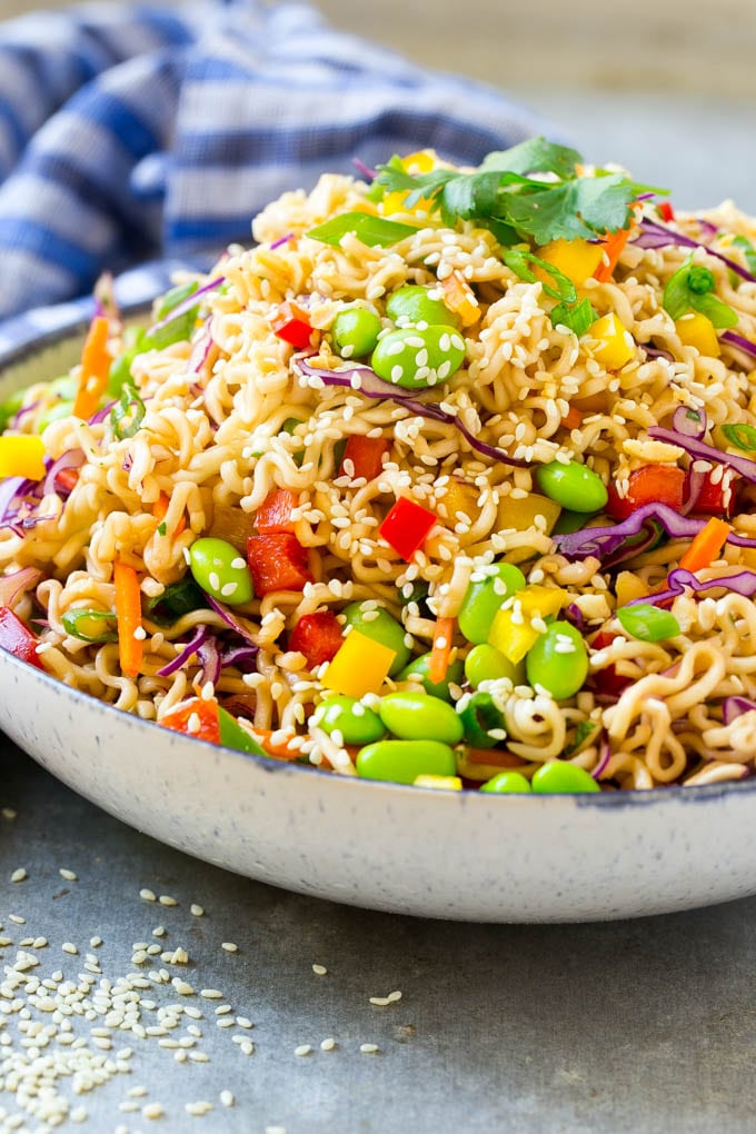 Asian Noodle Salad Recipe | Ramen Noodle Salad | Asian Salad #salad #noodles #edamame #vegetarian #ezlod #lunch A mixture of ramen noodles, carrots, edamame, cabbage and peppers in a serving bowl.