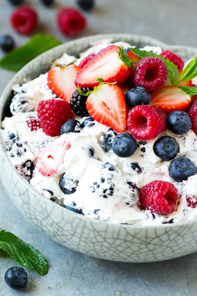 Berry Cheesecake Salad Recipe | Fruit Salad | Berry Fruit Salad | Cheesecake Salad #salad #cheesecake #fruit #berries #sidedish #dessert #ezlod A serving bowl of creamy berry salad topped with blueberries, raspberries and strawberries.