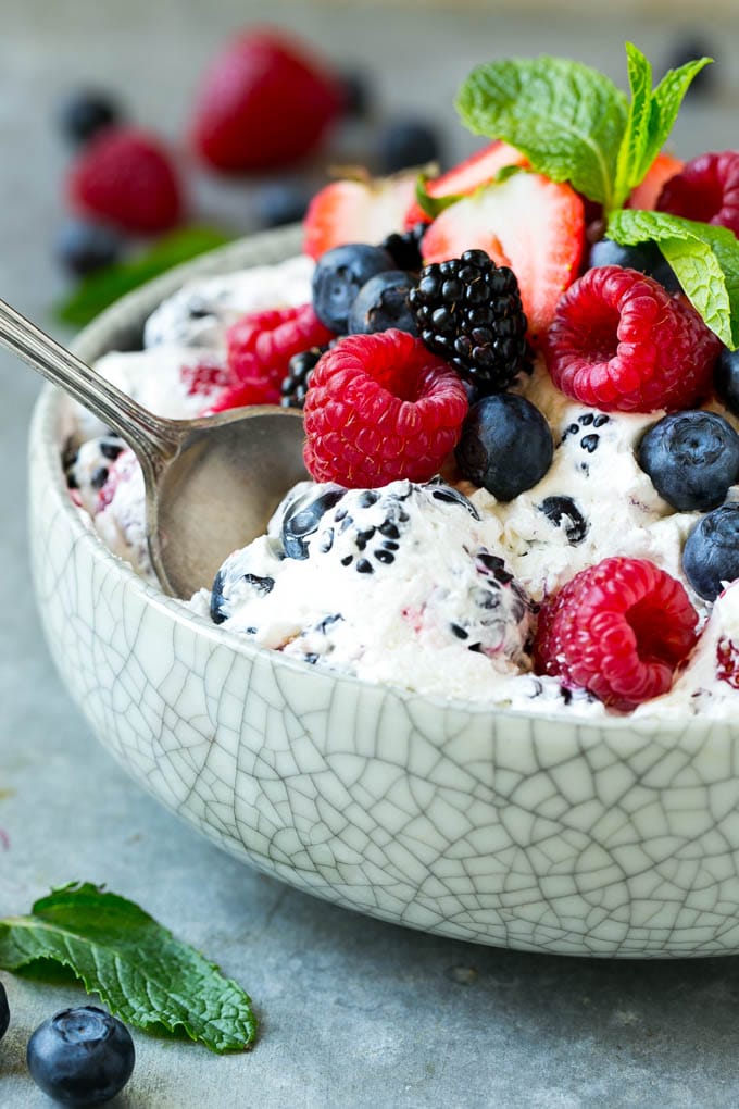 Berry Cheesecake Salad Recipe | Fruit Salad | Berry Fruit Salad | Cheesecake Salad #salad #cheesecake #fruit #berries #sidedish #dessert #ezlod Berry cheesecake salad in a bowl garnished with fresh berries and mint.