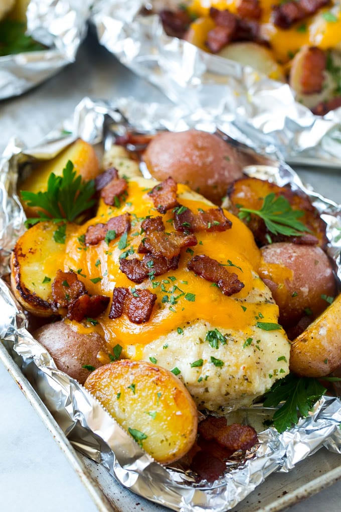 Bacon Ranch Chicken Foil Packets | Chicken in Foil | Foil Packet Recipe | Ranch Chicken #ranchchicken #grilling #chicken #foilpacket #foilpackets #bacon #dinner #ezlod Chicken in foil topped with cheddar cheese and bacon.