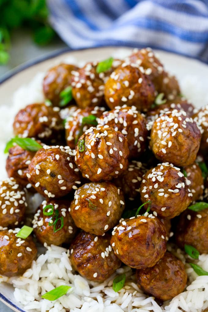 Teriyaki Meatballs Recipe | Asian Meatballs Recipe | Easy Meatball Recipe | Appetizer Meatballs #meatballs #teriyaki #beef #rice #dinner #ezlod Meatballs topped with homemade sauce and sesame seeds.