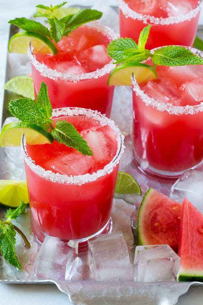 Watermelon Agua Fresca | Watermelon Drink | Agua Fresca Recipe #watermelon #aguafresca #watermelondrink #drink #ezlod #summer Watermelon agua fresca in sugar rimmed glasses with lime and mint for garnish.