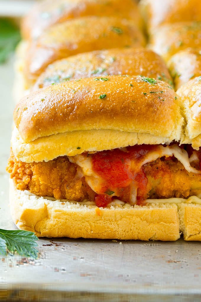 Chicken Parmesan Sliders | Chicken Parmesan Sandwich Recipe | Slider Sandwich Recipe #sliders #chickenparm #chickenparmesan #chickenparmesansliders #dinner #appetizer #ezlod Crispy chicken with tomato sauce and cheese on slider buns.