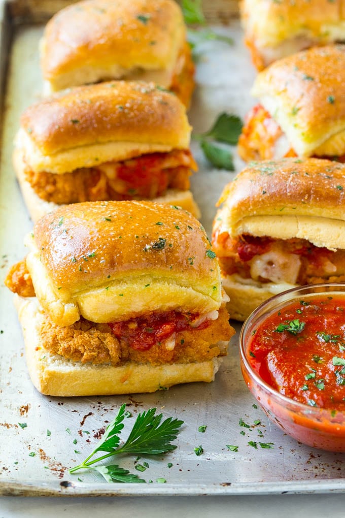 Chicken Parmesan Sliders | Chicken Parmesan Sandwich Recipe | Slider Sandwich Recipe #sliders #chickenparm #chickenparmesan #chickenparmesansliders #dinner #appetizer #ezlod Chicken parmesan sliders made with crispy chicken, marinara sauce and cheese on buns.