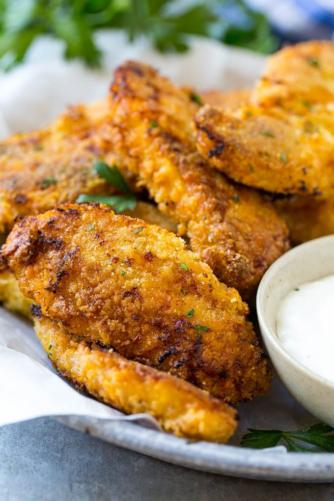 Baked Fried Chicken Recipe | Oven Fried Chicken | Baked Chicken Fingers | Crispy Chicken Fingers #chicken #friedchicken #bakedchicken #ovenfriedchicken #chickenfingers #dinner #ezlod Baked oven fried chicken fingers in a dish with a side of ranch dressing.