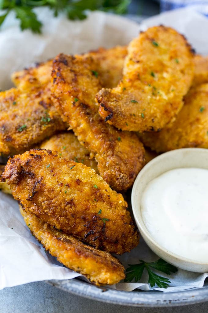 Baked Fried Chicken Recipe | Oven Fried Chicken | Baked Chicken Fingers | Crispy Chicken Fingers #chicken #friedchicken #bakedchicken #ovenfriedchicken #chickenfingers #dinner #ezlod Crispy baked fried chicken fingers on a plate with ranch dip.