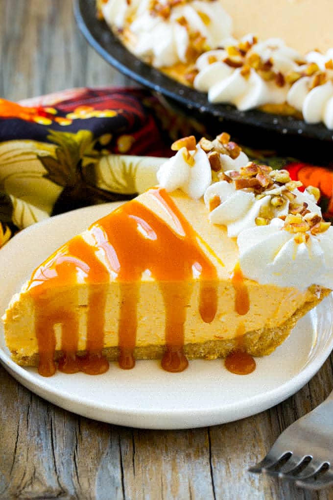 No Bake Pumpkin Cheesecake Recipe | Pumpkin Cheesecake | No Bake Cheesecake | Thanksgiving Dessert | Pumpkin Dessert #nobake #cheesecake #pumpkin #pumpkinpie #pumpkincheesecake #nobakecheesecake #dessert #ezlod A piece of no bake pumpkin flavored cheesecake topped with caramel.
