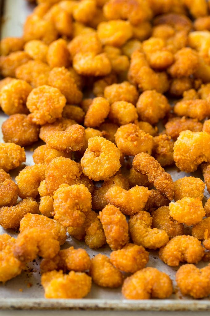 Sesame Shrimp Recipe | Crispy Shrimp | Popcorn Shrimp | Asian Shrimp | Easy Shrimp Recipe #shrimp #fried #friedshrimp #sesameshrimp #crispy #popcornshrimp #chinese #asian #dinner #ezlod A pan of cooked popcorn shrimp.