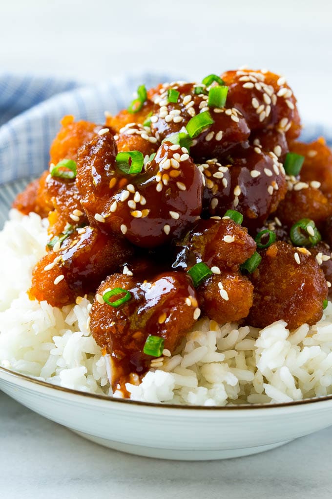 Sesame Shrimp Recipe | Crispy Shrimp | Popcorn Shrimp | Asian Shrimp | Easy Shrimp Recipe #shrimp #fried #friedshrimp #sesameshrimp #crispy #popcornshrimp #chinese #asian #dinner #ezlod A bowl of Asian style crispy sesame shrimp over rice.